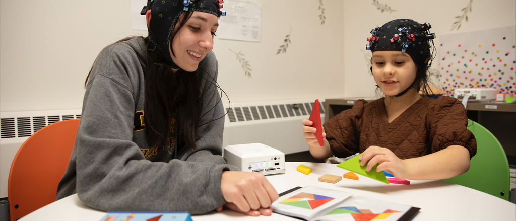 Lab member interacting with a student